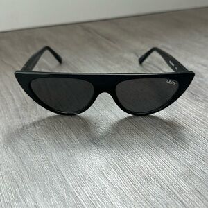Quay Australia “Run Away” sunglasses. Black plastic frame with black lens.